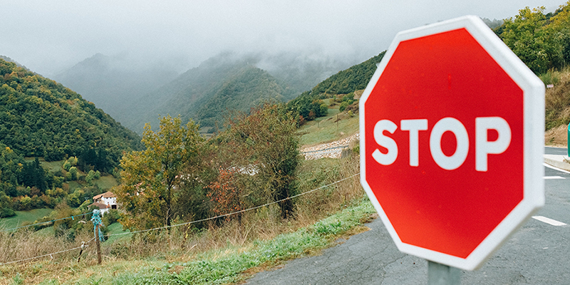 A guidepost "Stop."